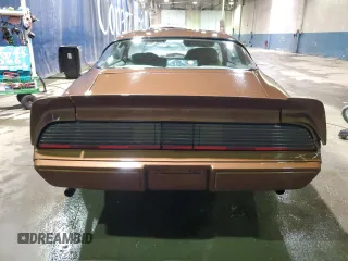 1979 Pontiac Firebird z VIN 2W87K9N184050, wystawiony jako Copart lot #75937874 z przebiegiem 18 509 mil mil oraz Szkody całkowita. Historia ofert i sprzedaży dostępna na DreamBid. Obrazek 6.