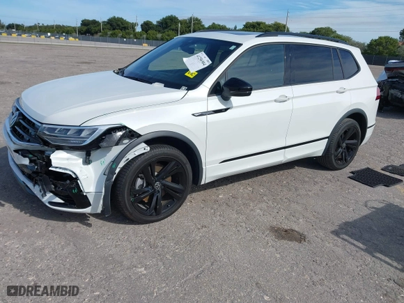 2023 Volkswagen Tiguan SE R-Line Black with VIN 3VVCB7AX0PM090710, listed as a IAAI auction lot 41256904 with 12,819 mi miles. Bid and sale history available at carsss.com. Image 2.