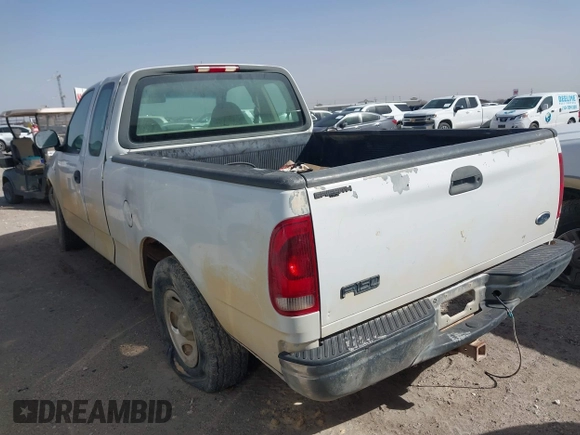 2000 Ford F-150 XL with VIN 1FTRX17W6YNC32992, listed as a IAAI auction lot 41633118 with 174,989 mi miles. Bid and sale history available at carsss.com. Image 3.