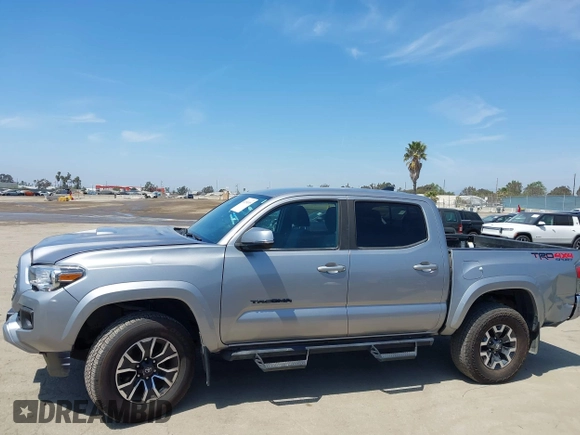 2021 Toyota Tacoma SR with VIN 3TMCZ5AN6MM393306, listed as a IAAI auction lot 42094095 with 57,217 mi miles and . Bid and sale history available at DreamBid. Image 14.