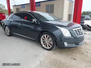 2014 Cadillac XTS Luxury with VIN 2G61M5S33E9217619, listed as a IAAI auction lot 41343003 with 126,303 mi miles. Bid and sale history available at carsss.com. Image 1.