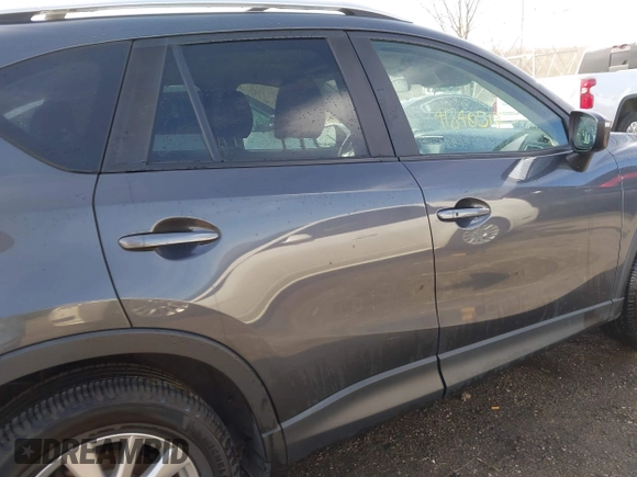 2016 Mazda CX-5 Touring with VIN JM3KE4CY9G0915305, listed as a IAAI auction lot 41840519 with 188,702 mi miles and . Bid and sale history available at carsss.com. Image 13.