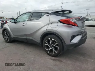 2018 Toyota C-HR XLE z VIN NMTKHMBX3JR023403, wystawiony jako Copart lot #54574245 z przebiegiem 119 657 mil mil oraz Szkoda całkowita • Salvage title. Historia ofert i sprzedaży dostępna na DreamBid. Obrazek 2.
