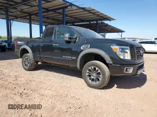 2018 Nissan Titan with VIN 1N6AA1C43JN549358, listed as a Copart auction lot 62417435 with 125,394 mi miles and Salvage title. Bid and sale history available at DreamBid. Image 4.