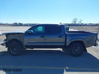 2019 Toyota Tacoma 4WD SR with VIN 3TMCZ5AN9KM275537, listed as a IAAI auction lot 41694037 with 102,933 mi miles. Bid and sale history available at carsss.com. Image 14.