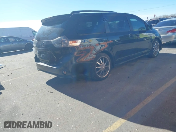 2012 Toyota Sienna SE with VIN 5TDXK3DC9CS179896, listed as a IAAI auction lot 41672616 with 216,638 mi miles. Bid and sale history available at carsss.com. Image 4.