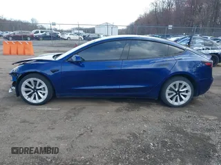 2022 Tesla Model 3 with VIN 5YJ3E1EA7NF188417, listed as a IAAI auction lot 41885623 with 105,457 mi miles and . Bid and sale history available at DreamBid. Image 14.