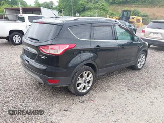 2016 Ford Escape Titanium with VIN 1FMCU9J93GUB93729, listed as a IAAI auction lot 42177294 with 158,859 mi miles and . Bid and sale history available at DreamBid. Image 4.