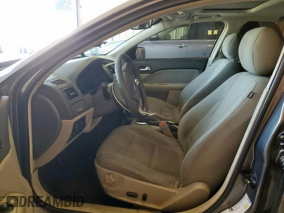 2012 Ford Fusion SE z VIN 3FAHP0HA1CR320160, wystawiony jako Copart lot #57597615 z przebiegiem 142 938 mil mil oraz Szkoda całkowita • Salvage title. Historia ofert i sprzedaży dostępna na DreamBid. Obrazek 7.
