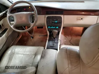 1999 Cadillac Eldorado z VIN 1G6EL12Y1XU611974, wystawiony jako Copart lot #71761494 z przebiegiem 139 494 mil mil oraz Czysty tytuł • Clean title. Historia ofert i sprzedaży dostępna na DreamBid. Obrazek 8.