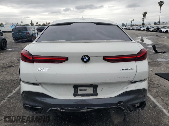 2022 BMW X6 xDrive40i z VIN 5UXCY6C08N9J21980, wystawiony jako Copart lot #48819745 z przebiegiem 24 431 mil mil oraz Szkoda całkowita • Salvage title. Historia ofert i sprzedaży dostępna na DreamBid. Obrazek 6.