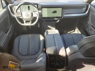 2022 Rivian R1S Launch Edition with VIN 7PDSGABL6NN001531, listed as a Copart auction lot 77143684 with 27,241 mi miles and Salvage Title. Bid and sale history available at carsss.com. Image 8.