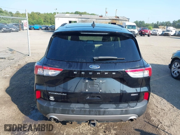 2021 Ford Escape Titanium Hybrid with VIN 1FMCU9DZ0MUB14833, listed as a IAAI auction lot 42593983 with 51,852 mi miles and . Bid and sale history available at DreamBid. Image 17.