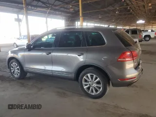 2013 Volkswagen Touareg Lux с VIN WVGEF9BP9DD003735, выставлен на аукционе Copart как лот 58852315 с пробегом 138 223 миль миль и Списание • Salvage title. История ставок и продаж доступна на DreamBid. Изображение 2.