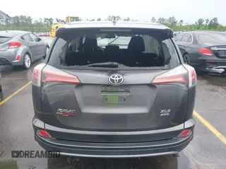 2018 Toyota RAV4 XLE with VIN 2T3RFREV5JW701564, listed as a IAAI auction lot 41976067 with 128,404 mi miles. Bid and sale history available at carsss.com. Image 16.