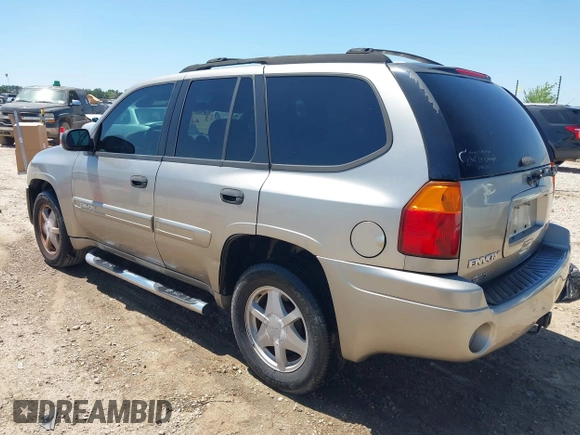 2003 GMC Envoy SLT with VIN 1GKDS13S732150215, listed as a IAAI auction lot 42048209 with 329,719 mi miles. Bid and sale history available at carsss.com. Image 3.