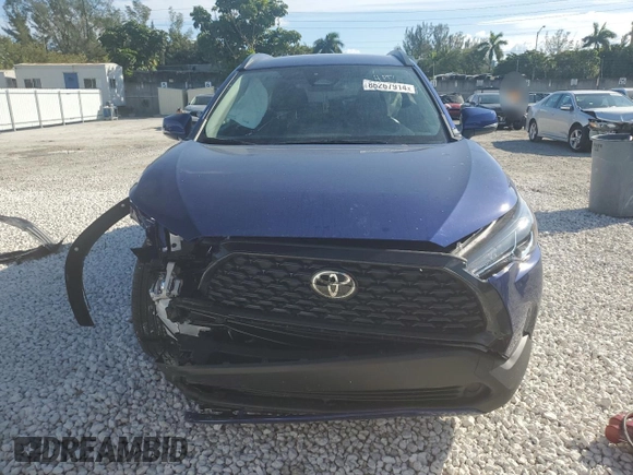 2023 Toyota Corolla Cross LE with VIN 7MUCAAAG0PV063737, listed as a Copart auction lot 86267914 with 13,740 mi miles and Salvage title. Bid and sale history available at DreamBid. Image 5.