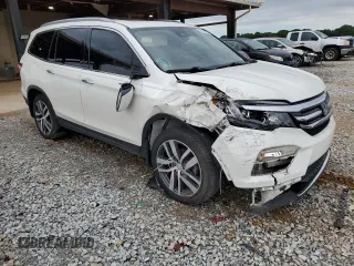 2017 Honda Pilot Touring z VIN 5FNYF6H92HB067140, wystawiony jako Copart lot #55757925 z przebiegiem 132 425 mil mil oraz Szkoda całkowita • Salvage title. Historia ofert i sprzedaży dostępna na DreamBid. Obrazek 4.