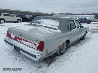 1986 Lincoln Town Car with VIN 1LNBP96F6GY618970, listed as a IAAI auction lot 41609991 with 22,768 mi miles. Bid and sale history available at carsss.com. Image 4.
