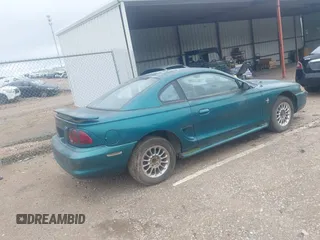 1996 Ford Mustang z VIN 1FALP4044TF226536, wystawiony jako IAAI lot #42468299 z przebiegiem 164 396 mil mil oraz . Historia ofert i sprzedaży dostępna na DreamBid. Obrazek 4.