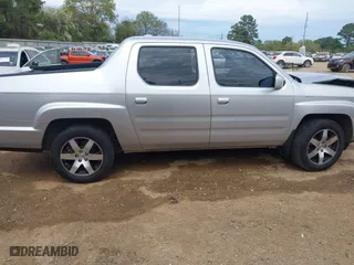 2014 Honda Ridgeline SE with VIN 5FPYK1F62EB013329, listed as a IAAI auction lot 41876728 with 127,014 mi miles. Bid and sale history available at carsss.com. Image 13.