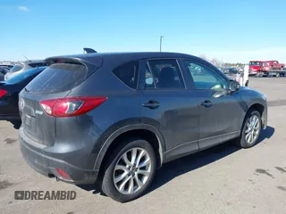 2014 Mazda CX-5 Grand Touring with VIN JM3KE4DY1E0364685, listed as a IAAI auction lot 41665349 with 135,751 mi miles. Bid and sale history available at carsss.com. Image 4.
