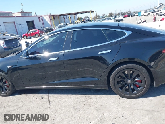 2017 Tesla Model S 100D with VIN 5YJSA1E21HF202591, listed as a IAAI auction lot 41983073 with 140,282 mi miles and . Bid and sale history available at DreamBid. Image 14.