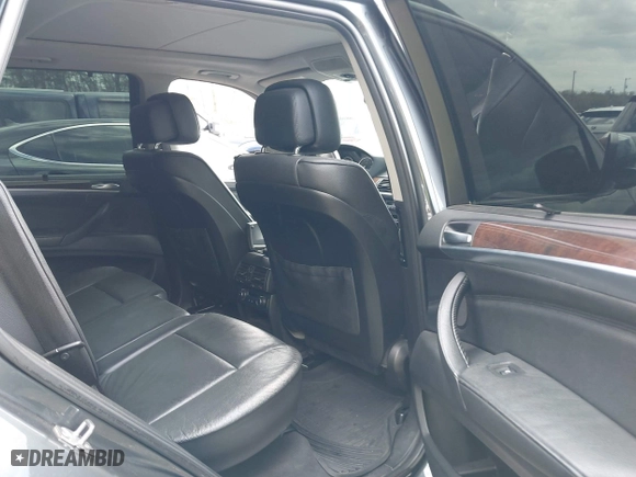 2011 BMW X5 35i with VIN 5UXZV4C56BL406632, listed as a IAAI auction lot 41981590 with 168,534 mi miles. Bid and sale history available at carsss.com. Image 8.