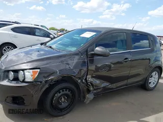 2014 Chevrolet Sonic LT with VIN 1G1JC6SHXE4135948, listed as a IAAI auction lot 41949833 with 127,202 mi miles. Bid and sale history available at carsss.com. Image 6.