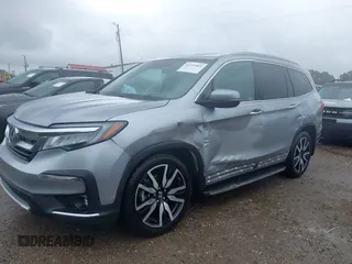 2019 Honda Pilot Touring 8-Passenger with VIN 5FNYF6H98KB097105, listed as a IAAI auction lot 42353009 with 133,212 mi miles and . Bid and sale history available at DreamBid. Image 2.