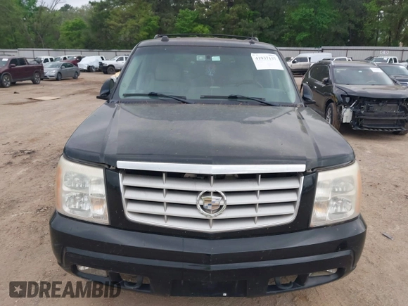 2005 Cadillac Escalade z VIN 1GYEC63TX5R203156, wystawiony jako IAAI lot #41937137 z przebiegiem 239 919 mil mil oraz . Historia ofert i sprzedaży dostępna na DreamBid. Obrazek 6.