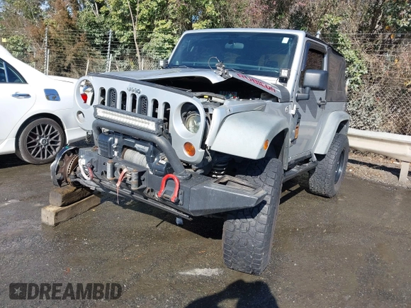 2011 Jeep Wrangler Rubicon with VIN 1J4BA6D10BL514776, listed as a IAAI auction lot 41487396 with 172,208 mi miles. Bid and sale history available at carsss.com. Image 2.