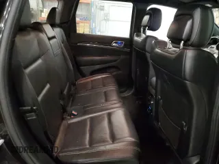 2015 Jeep Grand Cherokee Overland with VIN 1C4RJFCG7FC911899, listed as a Copart auction lot 54123925 with 243,031 mi miles and Salvage Title. Bid and sale history available at carsss.com. Image 11.