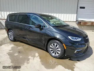 2023 Chrysler Pacifica Hybrid Touring L with VIN 2C4RC1L74PR631346, listed as a Copart auction lot 48480975 with 50,937 mi miles and Clean Title. Bid and sale history available at carsss.com. Image 4.