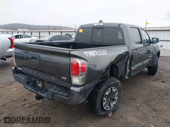 2022 Toyota Tacoma SR with VIN 3TMCZ5AN4NM476170, listed as a IAAI auction lot 41482149 with 57,126 mi miles and . Bid and sale history available at DreamBid. Image 4.