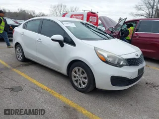 2015 Kia Rio LX with VIN KNADM4A37F6528238, listed as a IAAI auction lot 41851351 with 123,898 mi miles. Bid and sale history available at carsss.com. Image 1.