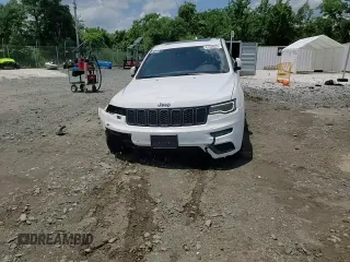 2018 Jeep Grand Cherokee High Altitude with VIN 1C4RJFCG5JC179040, listed as a Copart auction lot 61540625 with 135,310 mi miles and Salvage title. Bid and sale history available at DreamBid. Image 14.