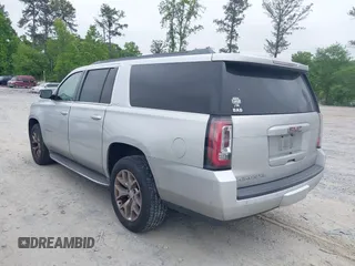 2015 GMC Yukon XL SLT with VIN 1GKS1HKC2FR251672, listed as a IAAI auction lot 42152312 with 232,736 mi miles and . Bid and sale history available at carsss.com. Image 3.