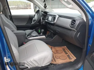 2018 Toyota Tacoma SR5 with VIN 3TMAZ5CNXJM069212, listed as a IAAI auction lot 42010564 with 73,825 mi miles and . Bid and sale history available at DreamBid. Image 5.