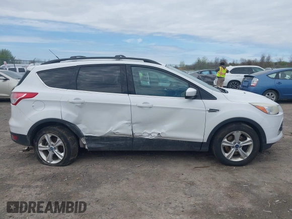 2013 Ford Escape SE with VIN 1FMCU9GX7DUA96986, listed as a IAAI auction lot 42160197 with 193,189 mi miles and . Bid and sale history available at DreamBid. Image 13.