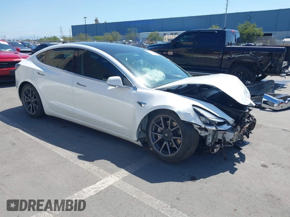 2020 Tesla Model 3 Standard Range Plus with VIN 5YJ3E1EAXLF590591, listed as a IAAI auction lot 42140338 with 79,342 mi miles and . Bid and sale history available at DreamBid. Image 1.