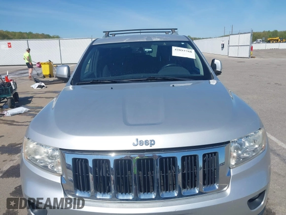 2011 Jeep Grand Cherokee Laredo z VIN 1J4RR4GGXBC571823, wystawiony jako IAAI lot #42093768 z przebiegiem 153 978 mil mil oraz . Historia ofert i sprzedaży dostępna na DreamBid. Obrazek 6.