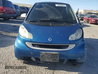2009 Smart fortwo Pure z VIN WMEEJ31X39K273968, wystawiony jako Copart lot #56888045 z przebiegiem 125 138 mil mil oraz Szkody całkowita. Historia ofert i sprzedaży dostępna na DreamBid. Obrazek 5.