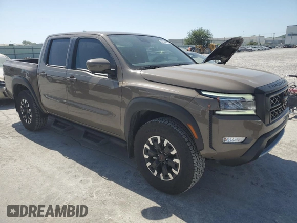 2023 Nissan Frontier Pro-4X with VIN 1N6ED1EK0PN668109, listed as a Copart auction lot 57064975 with 6,406 mi miles and Salvage title. Bid and sale history available at DreamBid. Image 4.