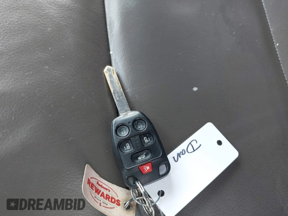 2013 Honda Odyssey EX-L with VIN 5FNRL5H63DB034963, listed as a IAAI auction lot 41921431 with 163,609 mi miles and . Bid and sale history available at DreamBid. Image 11.