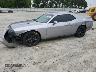 2013 Dodge Challenger SXT z VIN 2C3CDYAG7DH616196, wystawiony jako Copart lot #58909975 z przebiegiem 207 077 mil mil oraz Szkoda całkowita • Salvage title. Historia ofert i sprzedaży dostępna na DreamBid. Obrazek 1.
