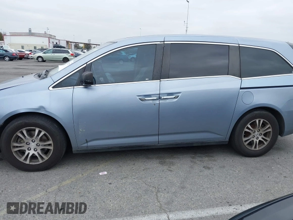 2012 Honda Odyssey EX-L with VIN 5FNRL5H66CB061847, listed as a IAAI auction lot 42162377 with 217,204 mi miles and . Bid and sale history available at DreamBid. Image 14.