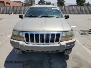 1999 Jeep Grand Cherokee Laredo with VIN 1J4GW58S1XC775877, listed as a Copart auction lot 55639795 with 197,611 mi miles and Salvage title. Bid and sale history available at DreamBid. Image 5.