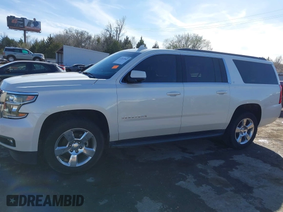 2015 Chevrolet Suburban LT with VIN 1GNSKJKC9FR717038, listed as a IAAI auction lot 41815942 with 123,095 mi miles and . Bid and sale history available at DreamBid. Image 14.