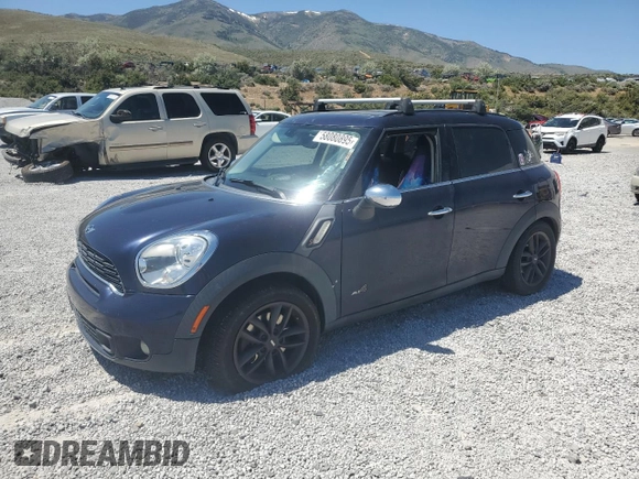 2013 MINI Countryman S ALL4 with VIN WMWZC5C50DWM15256, listed as a Copart auction lot 58080895 with 123,514 mi miles and Salvage title. Bid and sale history available at DreamBid. Image 1.
